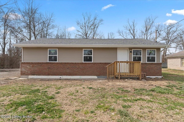 ranch-style house featuring brick siding