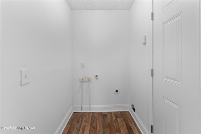 laundry room with baseboards, laundry area, hookup for an electric dryer, a textured ceiling, and dark wood-style flooring