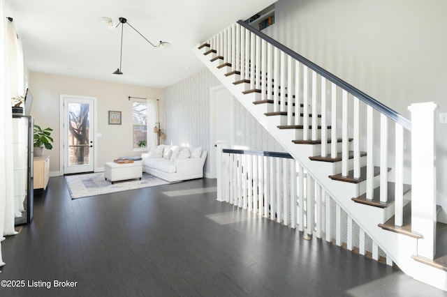 stairs featuring baseboards and hardwood / wood-style flooring