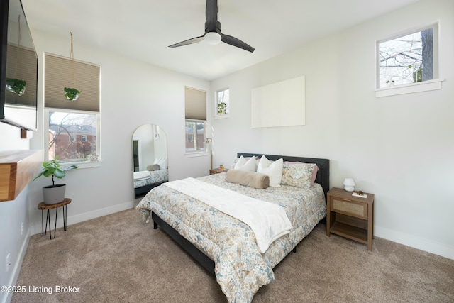 bedroom featuring a ceiling fan, baseboards, and carpet floors