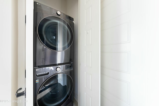 clothes washing area featuring laundry area and stacked washer / drying machine