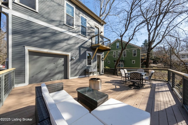 wooden deck featuring outdoor dining space and an outdoor hangout area