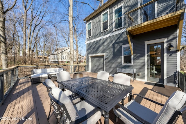 deck with outdoor dining space