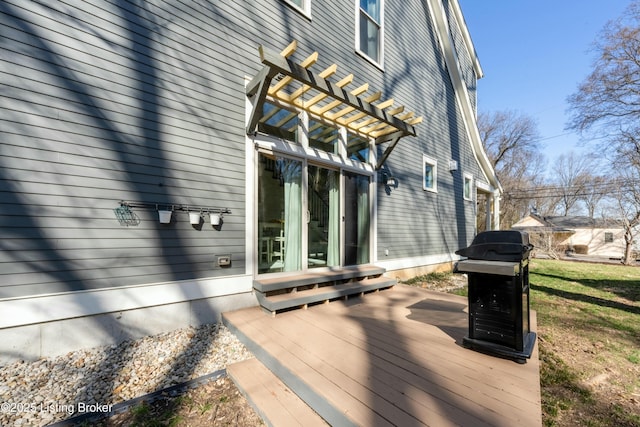 deck featuring a pergola and a grill