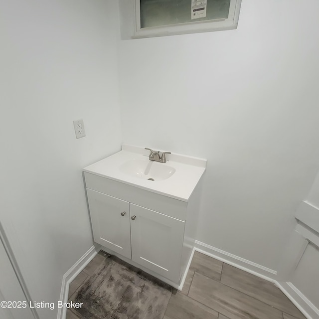 bathroom with baseboards and vanity