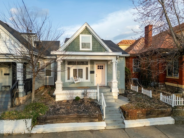 craftsman inspired home with fence