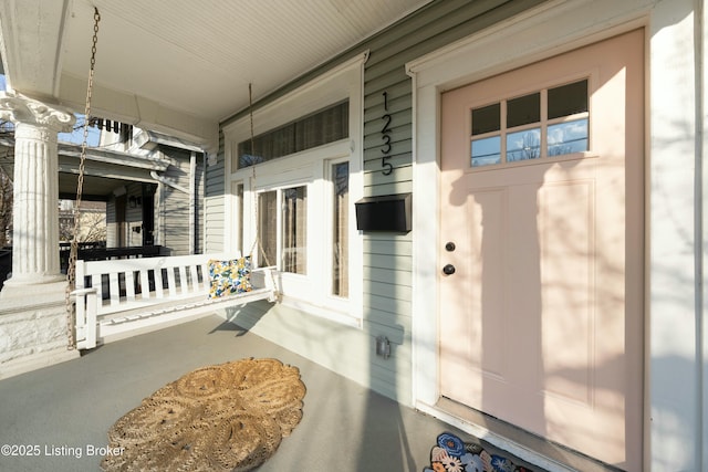 entrance to property with a porch