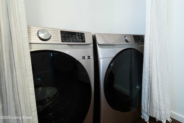 laundry area with laundry area and washer and clothes dryer