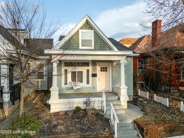 view of front of house featuring fence