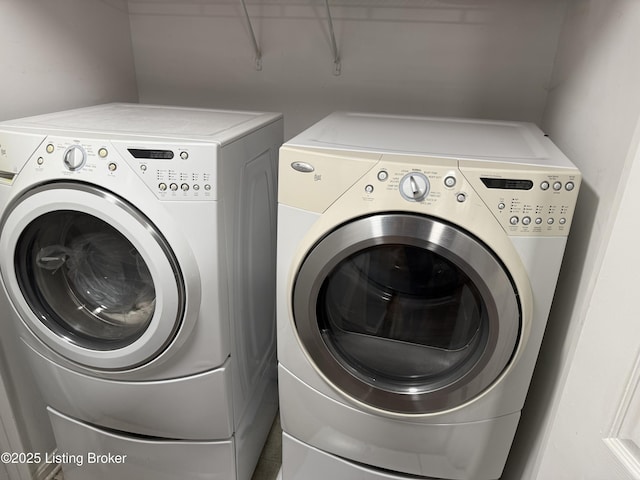 clothes washing area featuring laundry area and independent washer and dryer