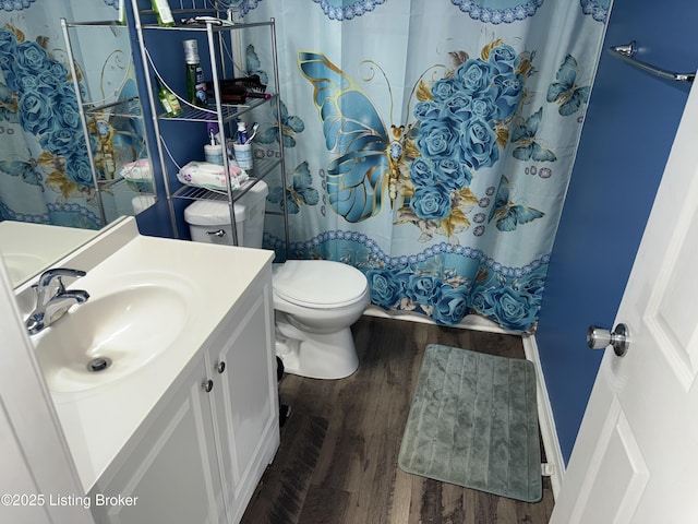 full bathroom with toilet, vanity, a shower with curtain, and wood finished floors