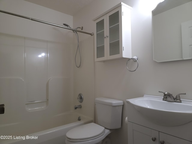 full bath featuring washtub / shower combination, toilet, and vanity