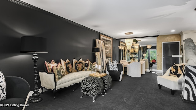 carpeted living room with an inviting chandelier