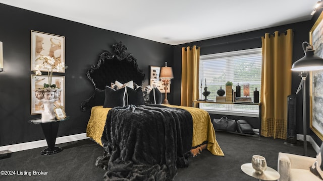 bedroom with baseboards and carpet floors