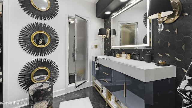 bathroom with baseboards and vanity