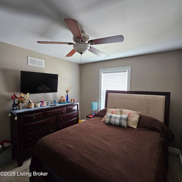 bedroom with light carpet, visible vents, and ceiling fan