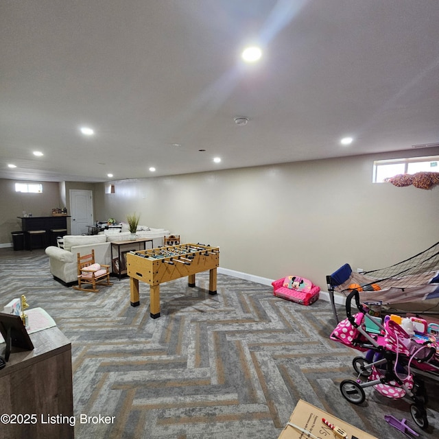 recreation room featuring recessed lighting, baseboards, and a wealth of natural light