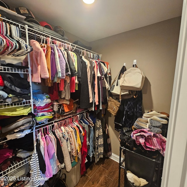 spacious closet with wood finished floors