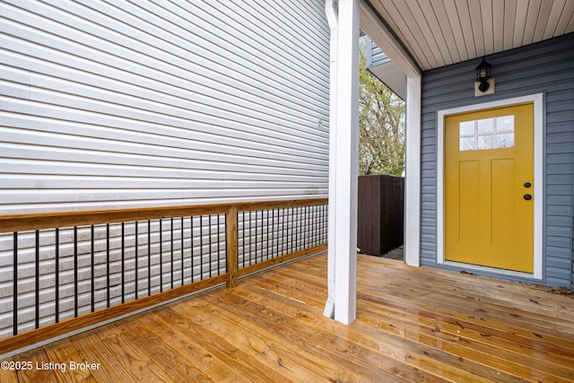 entrance to property featuring a wooden deck