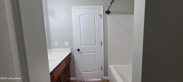 bathroom with a tub, vanity, and walk in shower