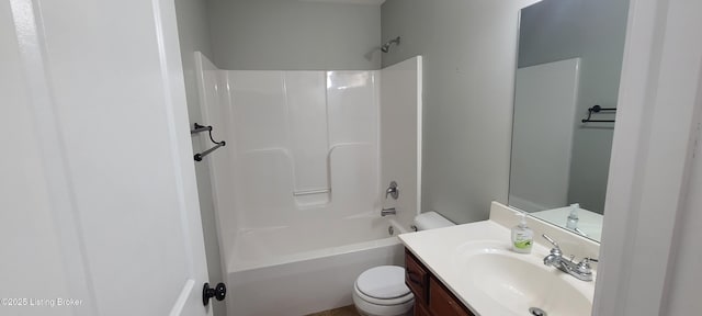 bathroom featuring shower / tub combination, toilet, and vanity