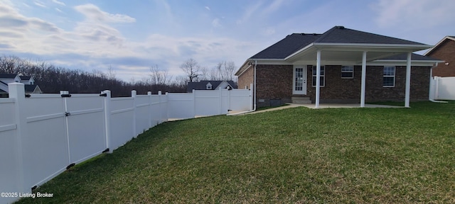 view of yard featuring a patio area and a fenced backyard