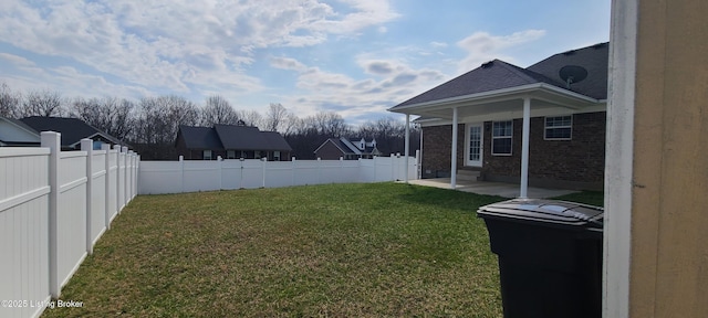 view of yard featuring a patio and a fenced backyard