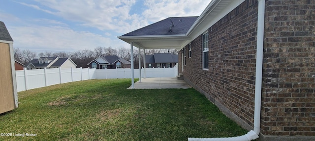 view of yard featuring a patio and fence