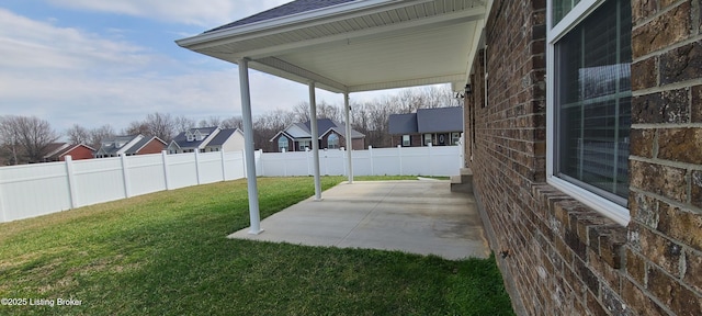 view of patio featuring fence and a residential view