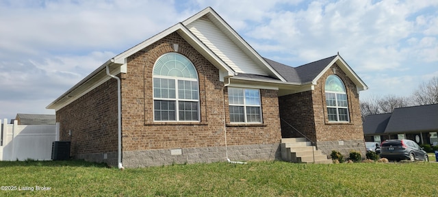 view of property exterior with a lawn, brick siding, roof with shingles, and crawl space