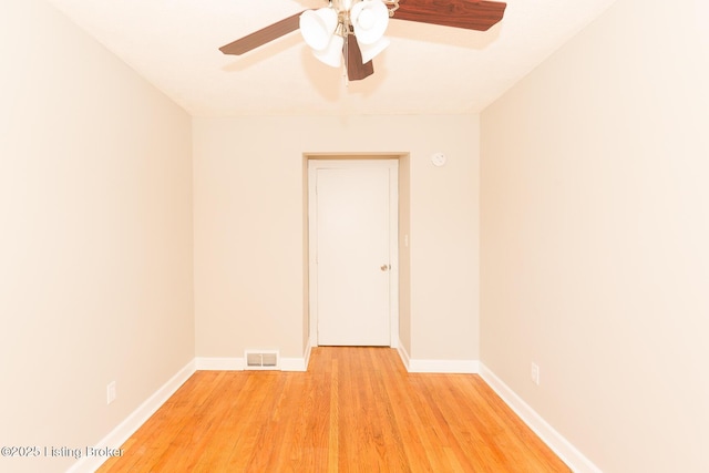 unfurnished room featuring visible vents, baseboards, light wood-type flooring, and ceiling fan