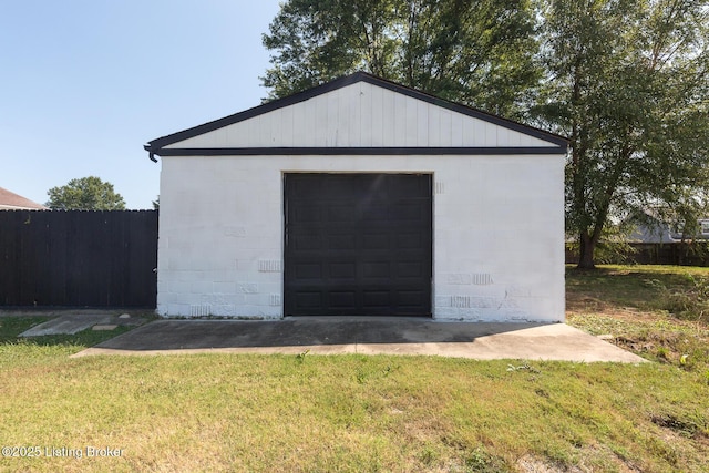 exterior space with an outdoor structure and fence