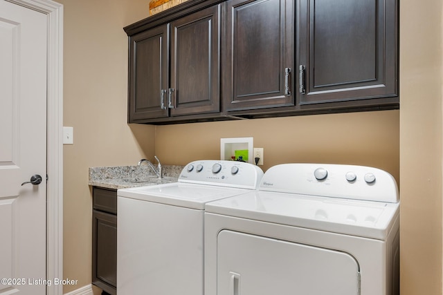 washroom with cabinet space and independent washer and dryer