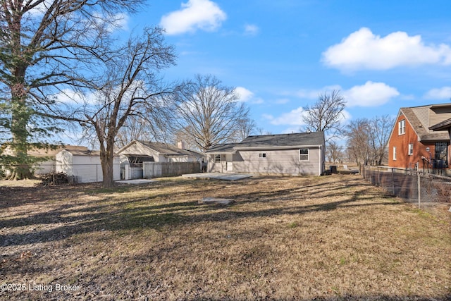 exterior space featuring a yard, a patio, and a fenced backyard