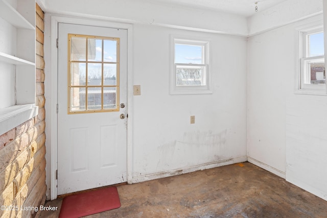 doorway to outside featuring concrete flooring