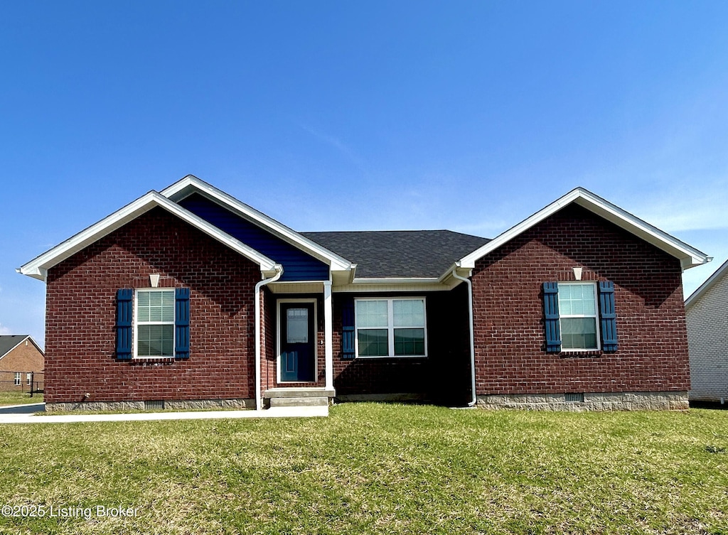 ranch-style house featuring a front yard, brick siding, and crawl space