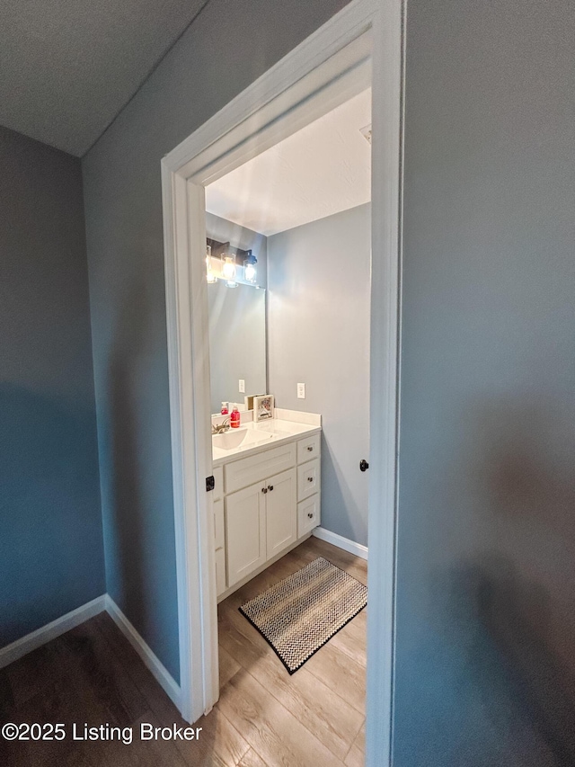 306 Oak Hill Ct, Bardstown, KY 40004 - bathroom with vanity, baseboards, and wood finished floors