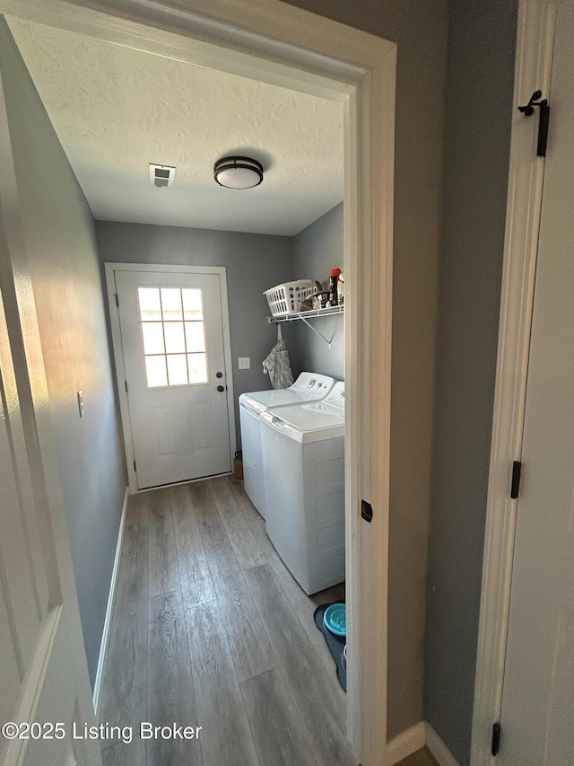 306 Oak Hill Ct, Bardstown, KY 40004 - clothes washing area featuring visible vents, a textured ceiling, hardwood / wood-style floors, washing machine and dryer, and laundry area