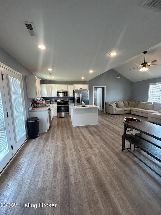 306 Oak Hill Ct, Bardstown, KY 40004 - interior space featuring vaulted ceiling, wood finished floors, visible vents, and ceiling fan