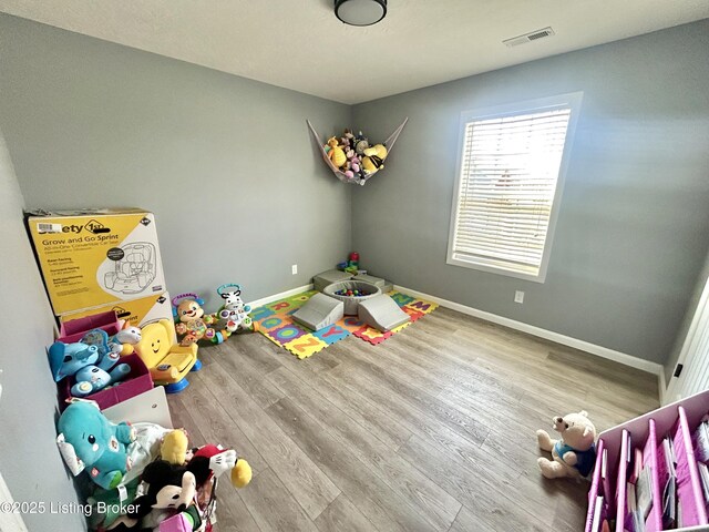 306 Oak Hill Ct, Bardstown, KY 40004 - rec room featuring wood finished floors, visible vents, and baseboards
