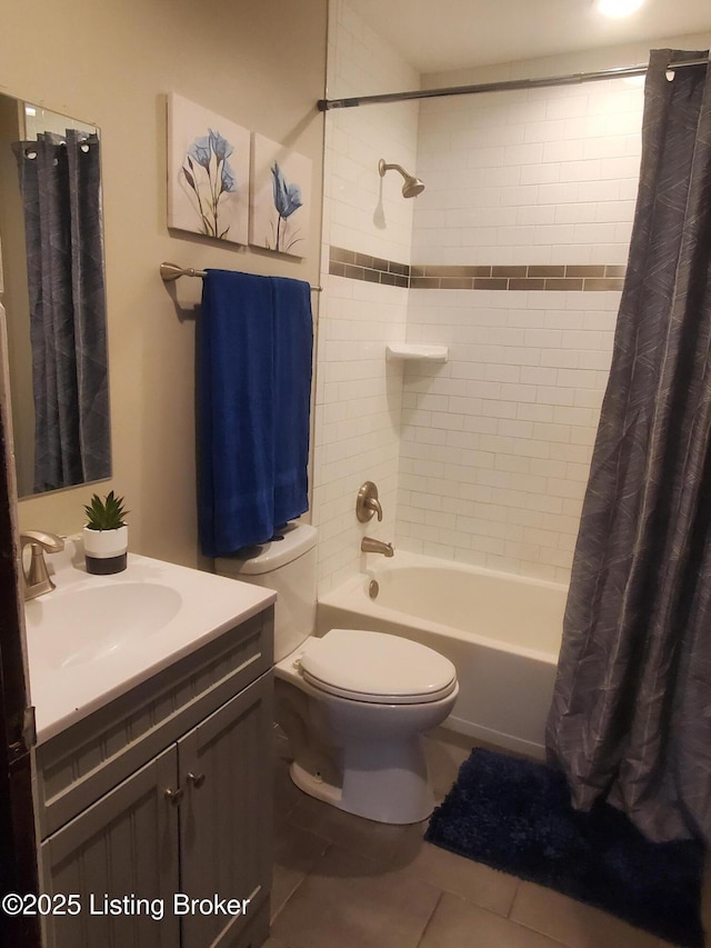 bathroom featuring tile patterned flooring, toilet, vanity, and shower / bathtub combination with curtain