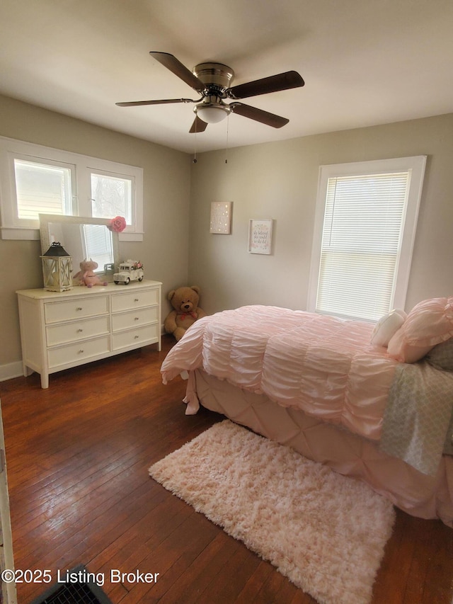 bedroom featuring dark wood-style floors and a ceiling fan