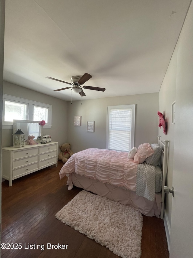 bedroom with dark wood-style floors and a ceiling fan