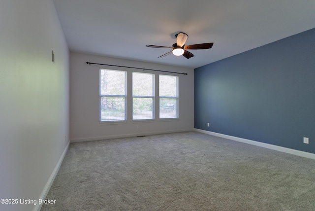 unfurnished room featuring ceiling fan, baseboards, and carpet floors