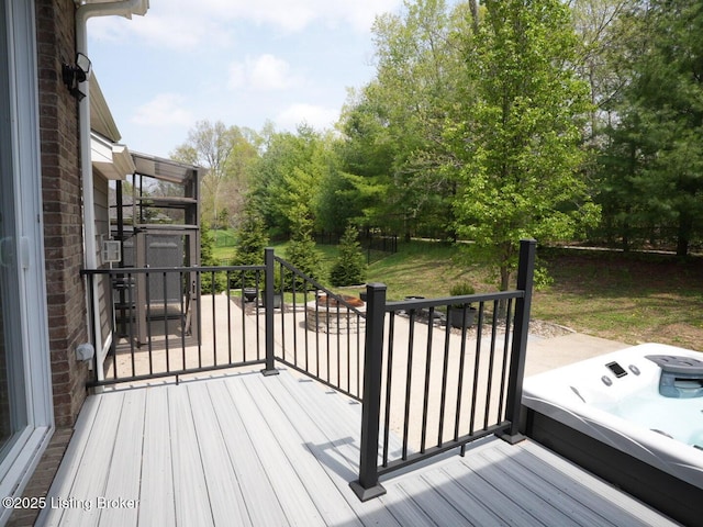 deck with a hot tub