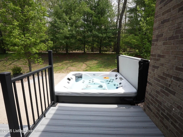 wooden terrace with a covered hot tub