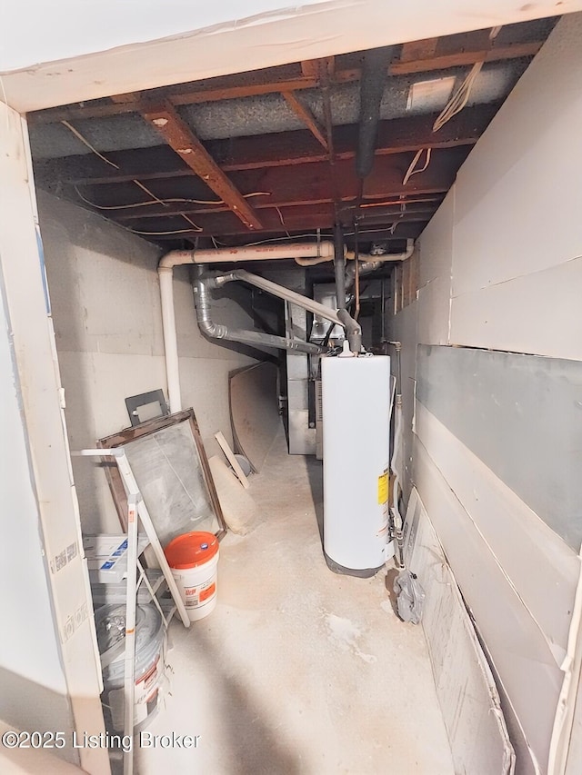 unfinished basement featuring gas water heater