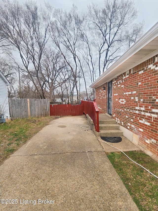 view of patio featuring fence