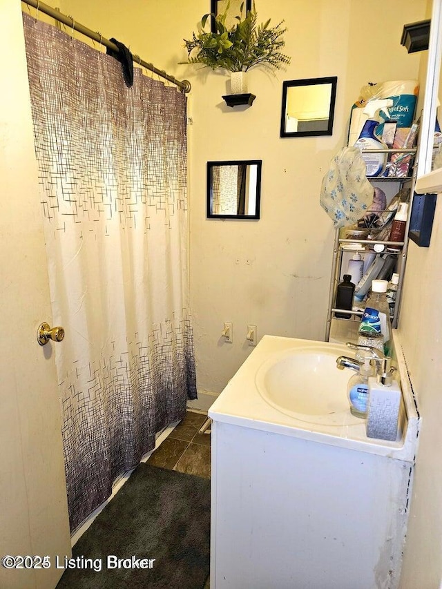 bathroom featuring vanity and a shower with curtain