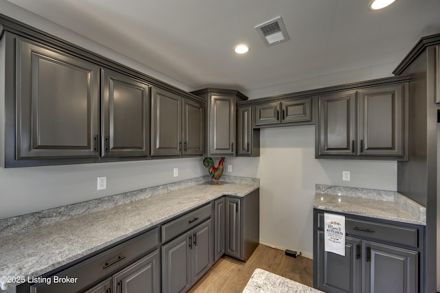 kitchen featuring recessed lighting, visible vents, and light wood-type flooring